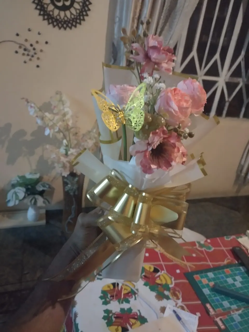 Pink flowers with ribbon and a gold butterfly detail